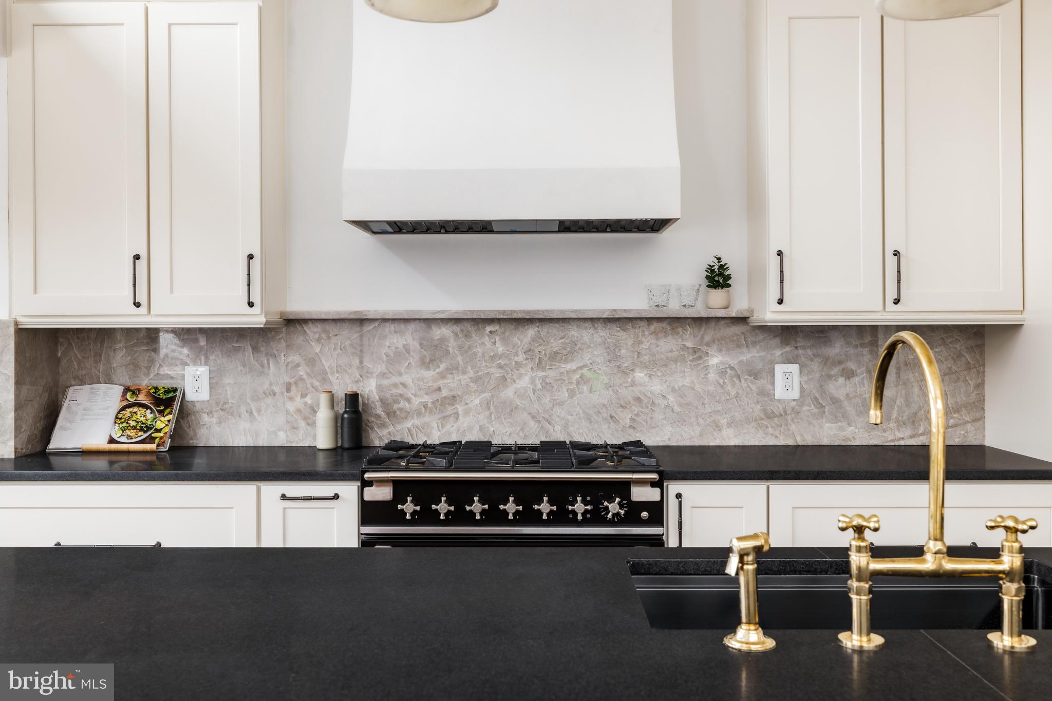 304 N Street Northwest, Unit 1 Washington, DC 20001 - Photo 15 of 47 a kitchen with a stove and cabinets