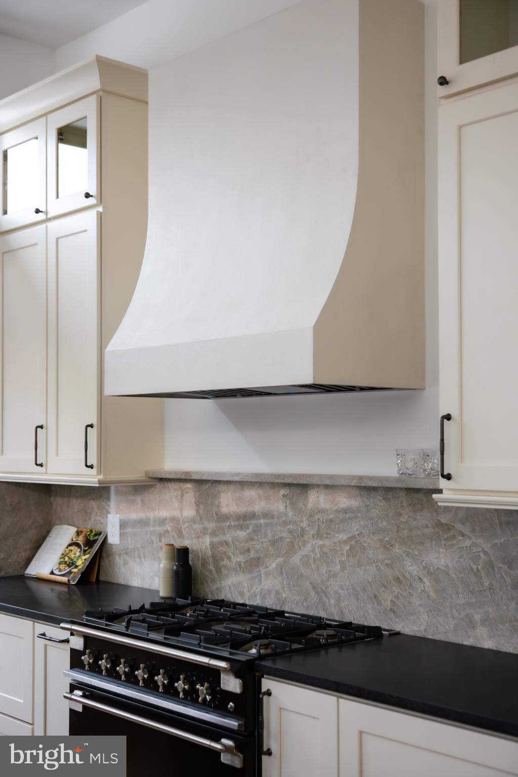 304 N Street Northwest, Unit 1 Washington, DC 20001 - Photo 18 of 47 a close view of a stove a microwave and cabinets in the kitchen