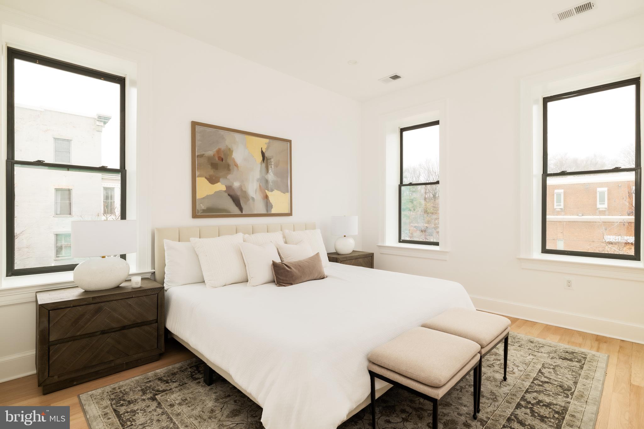 304 N Street Northwest, Unit 1 Washington, DC 20001 - Photo 25 of 47 a bedroom with a bed and wooden floor