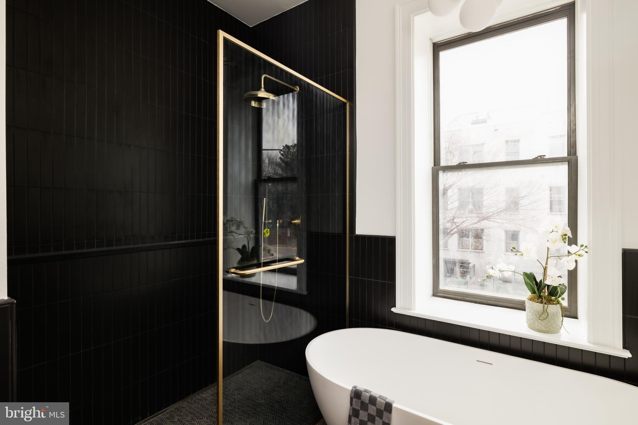 304 N Street Northwest, Unit 1 Washington, DC 20001 - Photo 32 of 47 a bathroom with a sink and a mirror