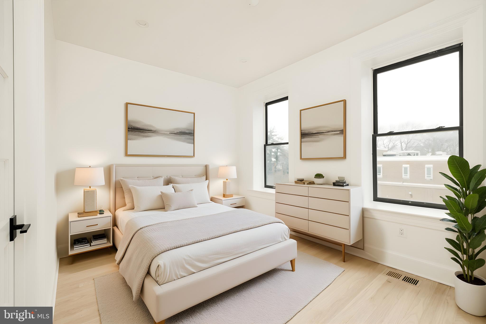 304 N Street Northwest, Unit 1 Washington, DC 20001 - Photo 34 of 47 a bedroom with a bed and a potted plant