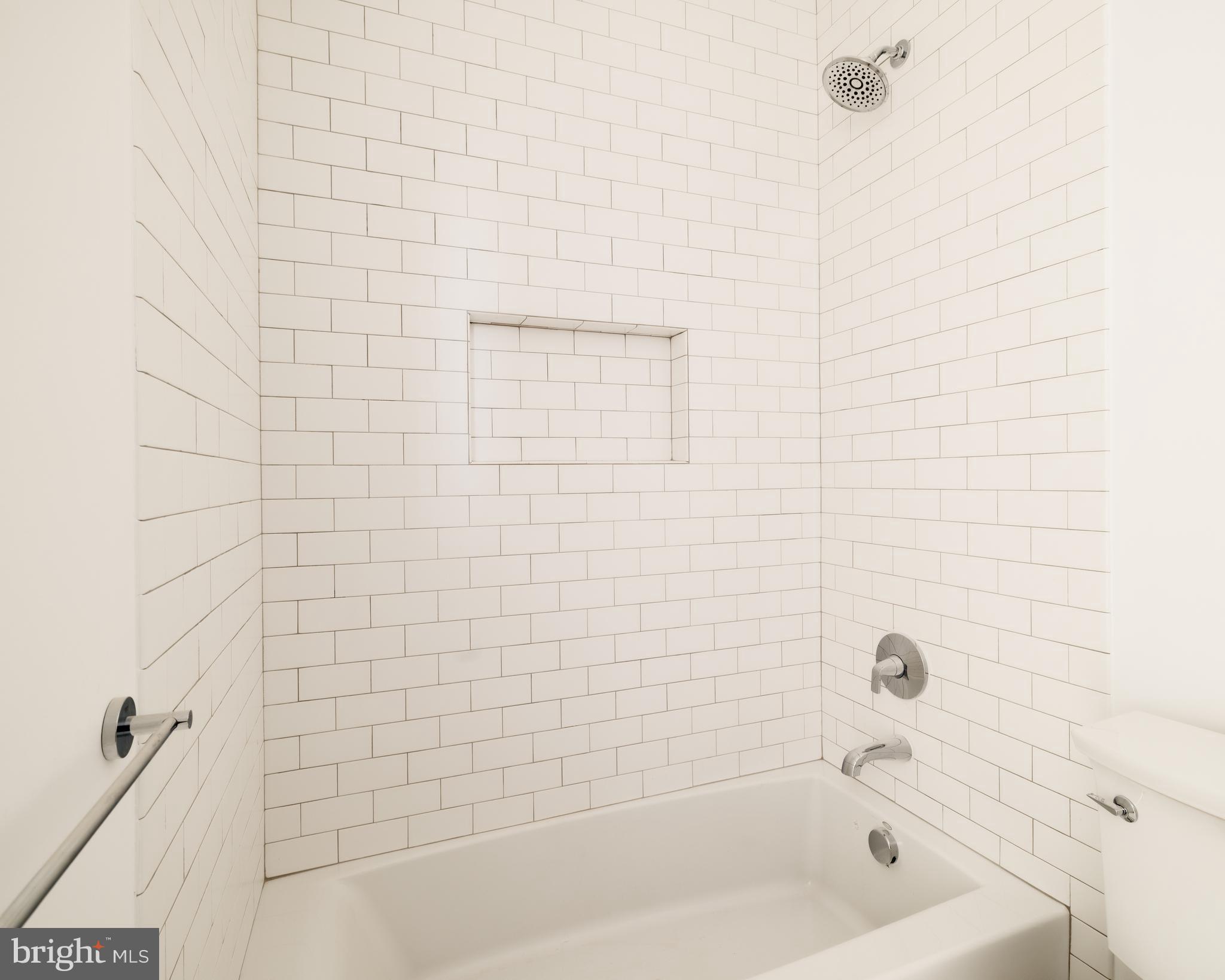 304 N Street Northwest, Unit 1 Washington, DC 20001 - Photo 38 of 47 a bathroom with a bathtub