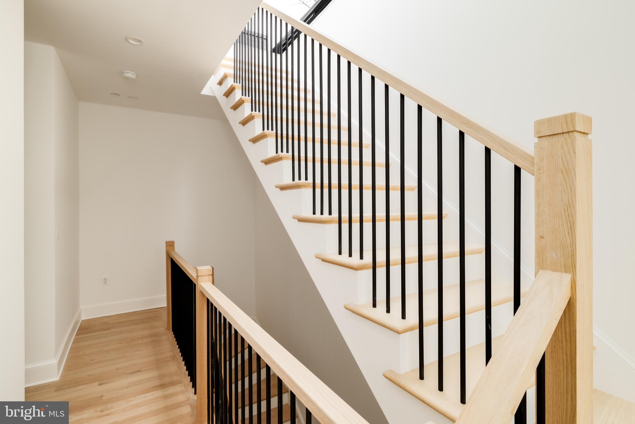 304 N Street Northwest, Unit 1 Washington, DC 20001 - Photo 40 of 47 a view of a hallway with wooden floor and staircase