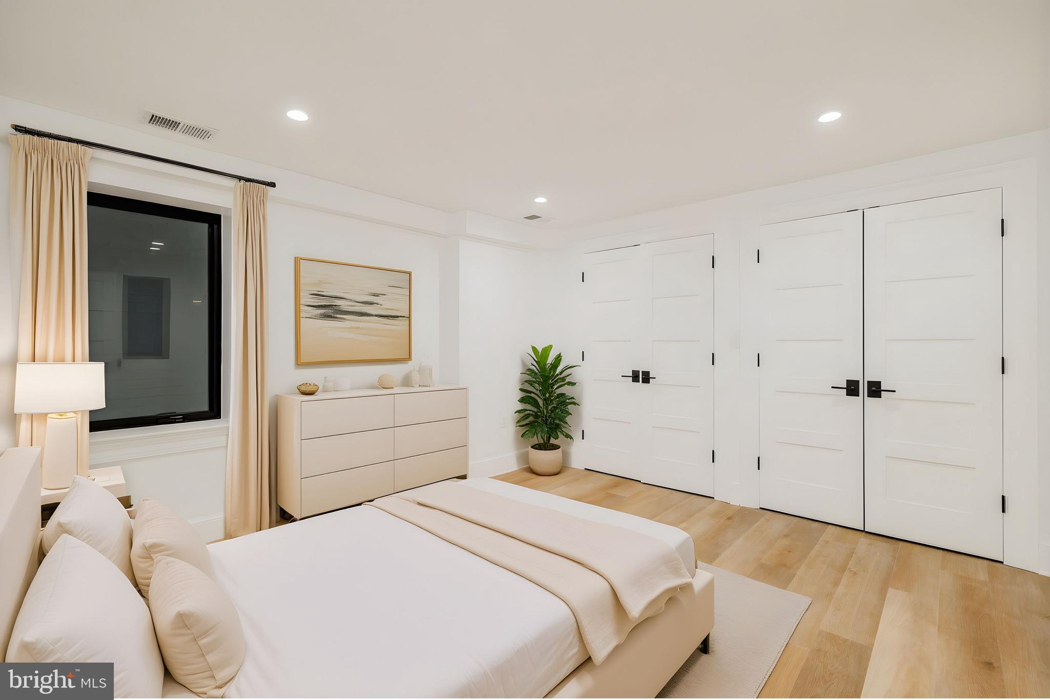 304 N Street Northwest, Unit 1 Washington, DC 20001 - Photo 45 of 47 a bedroom with a bed and a cabinets