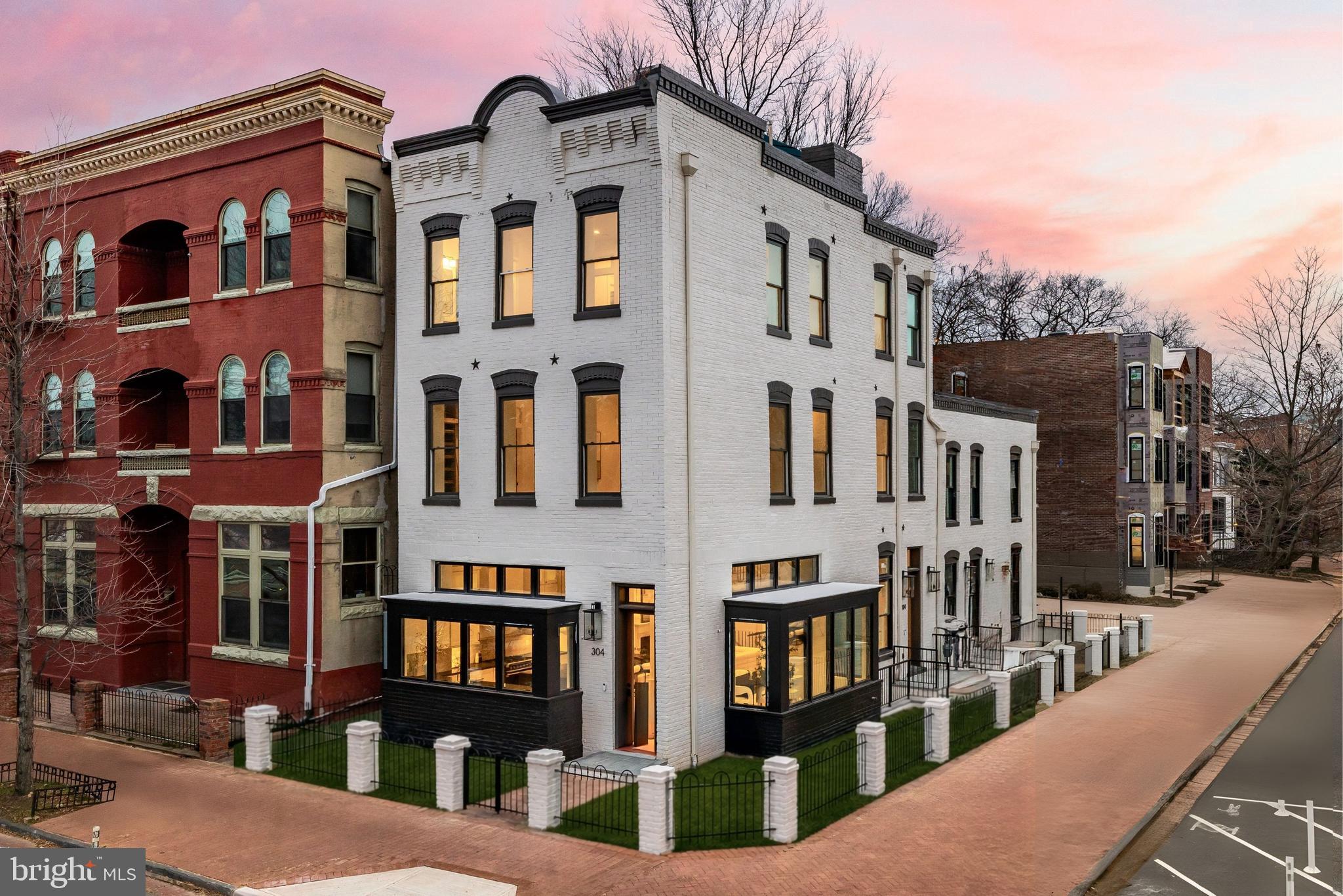 304 N Street Northwest, Unit 1 Washington, DC 20001 - Photo 47 of 47 a front view of a residential apartment building with a yard