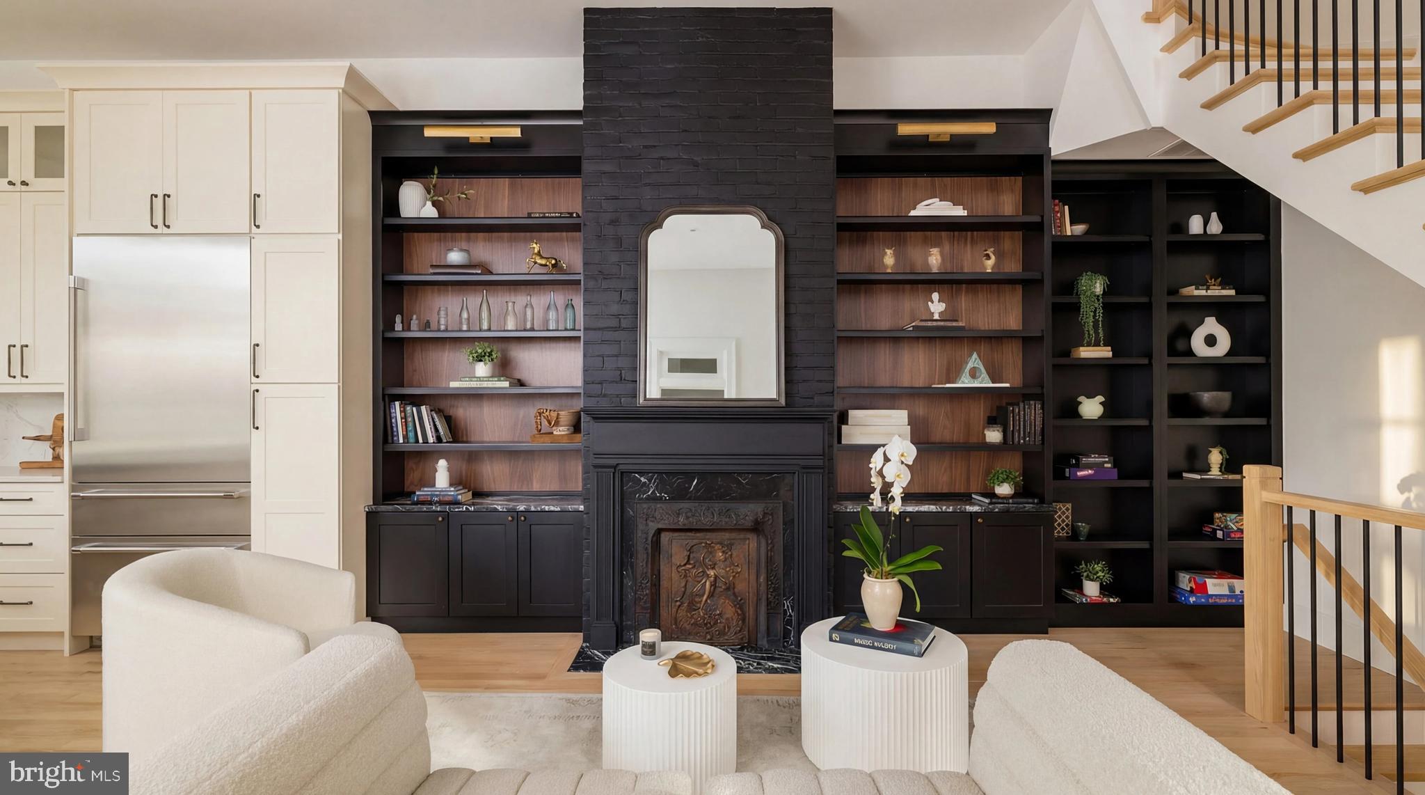 304 N Street Northwest, Unit 1 Washington, DC 20001 - Photo 6 of 47 a living room with furniture a bookshelf and a refrigerator