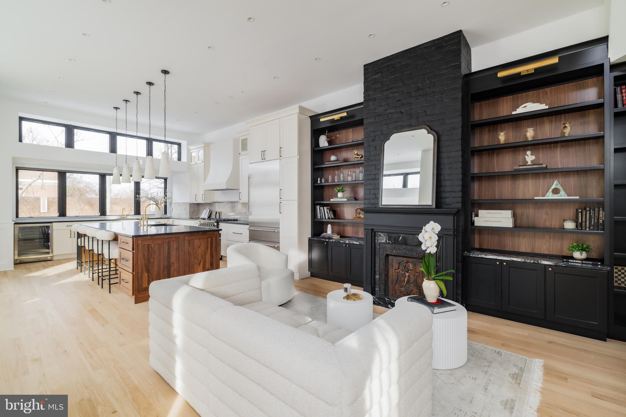 304 N Street Northwest, Unit 1 Washington, DC 20001 - Photo 8 of 47 a living room with furniture a chandelier and kitchen view