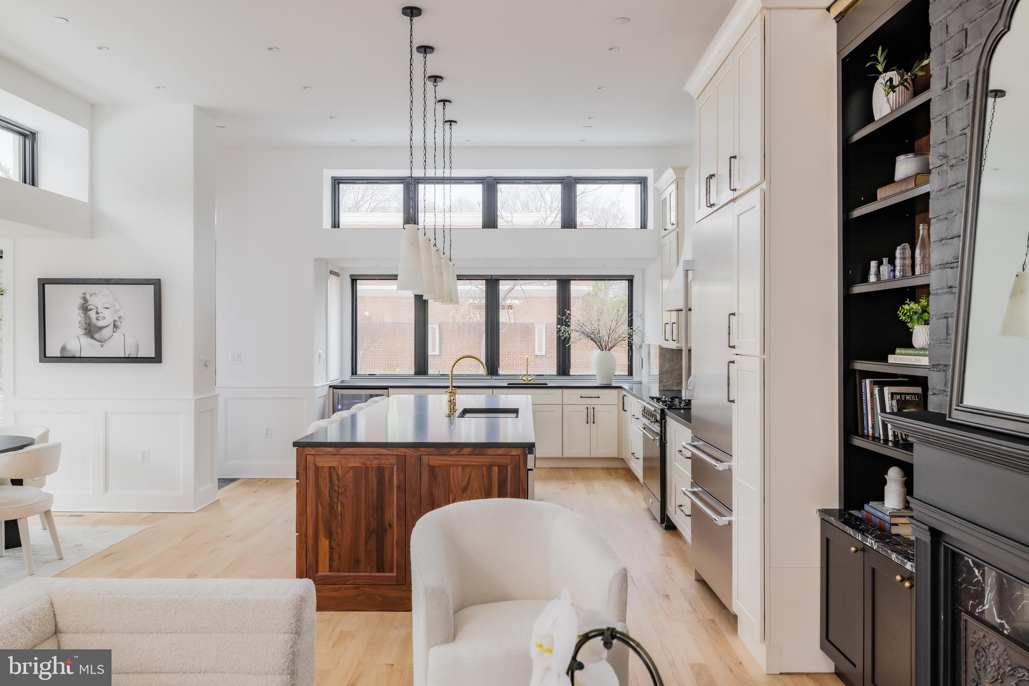 304 N Street Northwest, Unit 1 Washington, DC 20001 - Photo 10 of 47 a living room with furniture a window and bookshelf