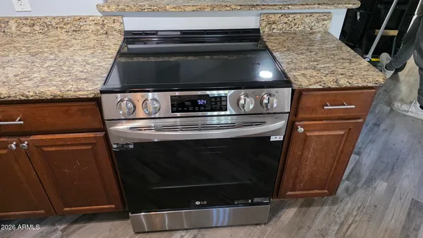 a stove top oven sitting inside of a kitchen