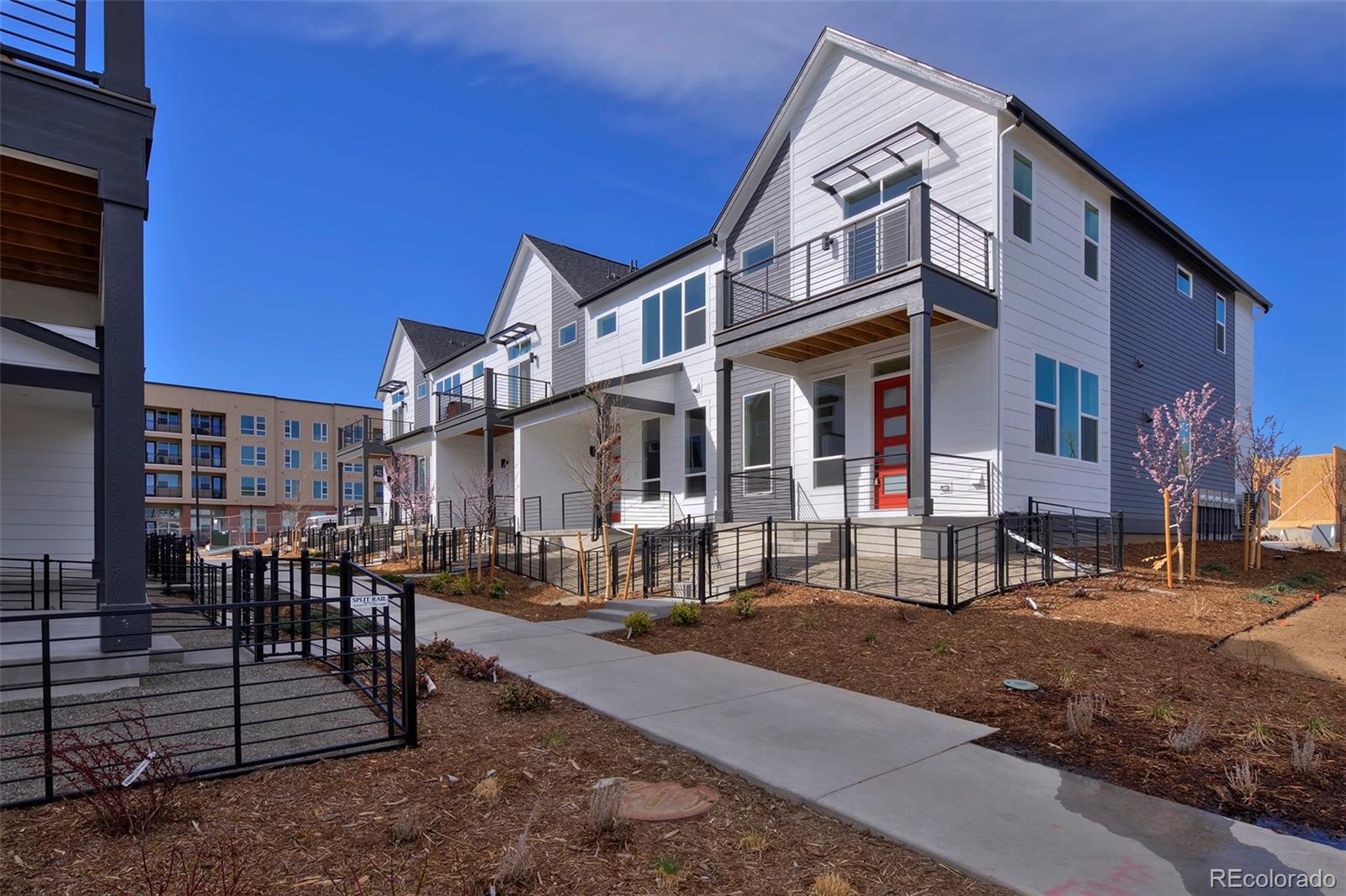 3136 West Bonfils Place Denver, CO 80236 - Photo 2 of 43 a view of a building with sitting area