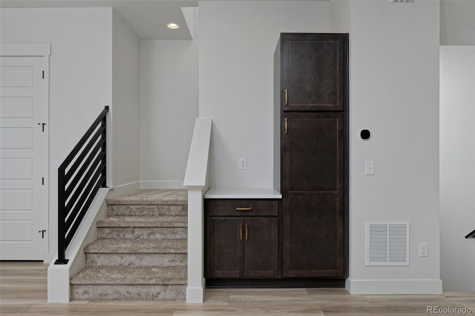 3136 West Bonfils Place Denver, CO 80236 - Photo 21 of 43 a view of entryway with wooden floor