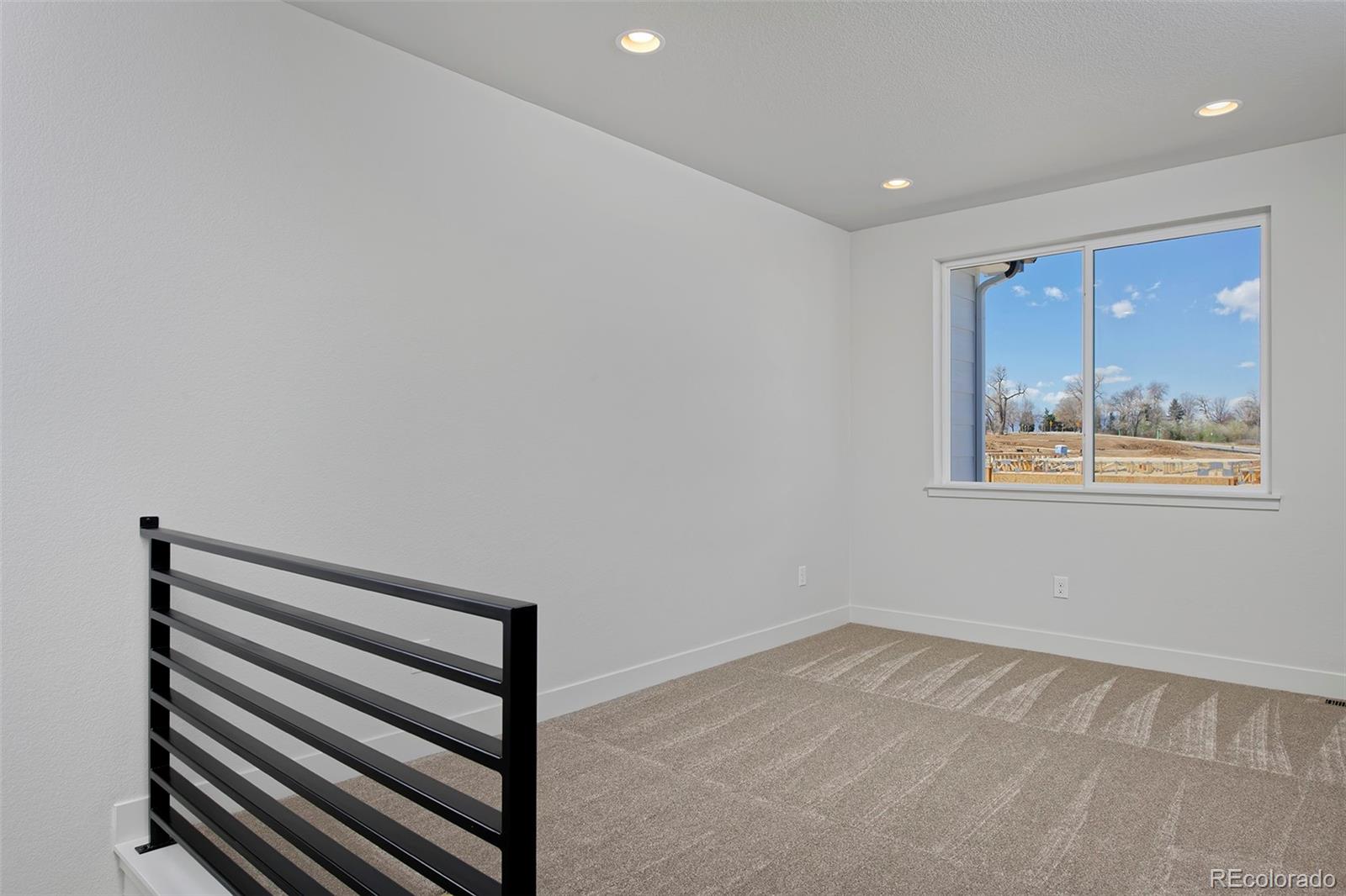 3136 West Bonfils Place Denver, CO 80236 - Photo 23 of 43 a view of room with wooden floor and window