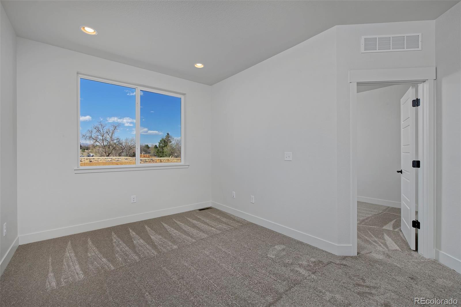 3136 West Bonfils Place Denver, CO 80236 - Photo 24 of 43 a view of a hallway with closet