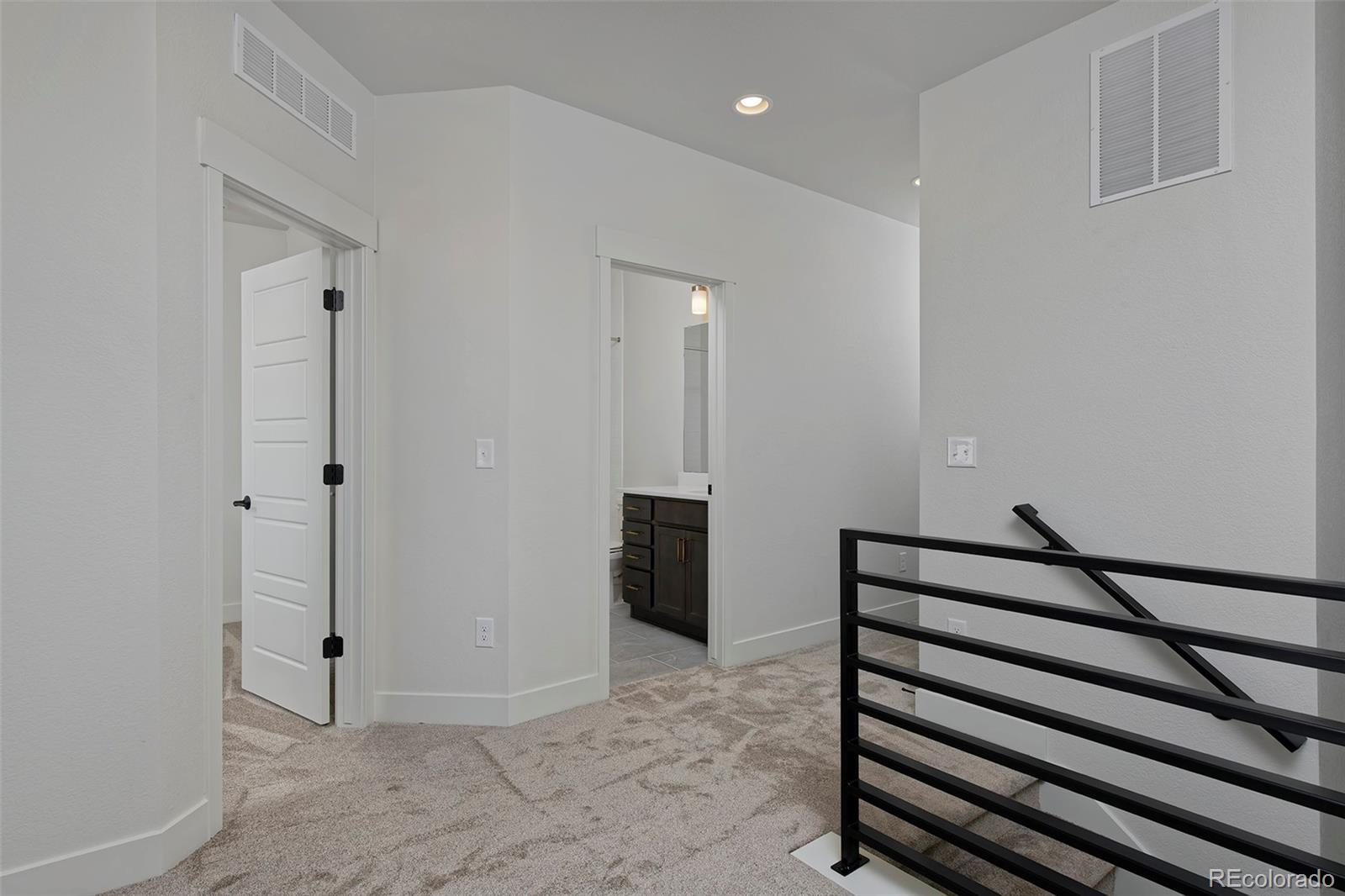 3136 West Bonfils Place Denver, CO 80236 - Photo 25 of 43 a view of entryway with wooden floor