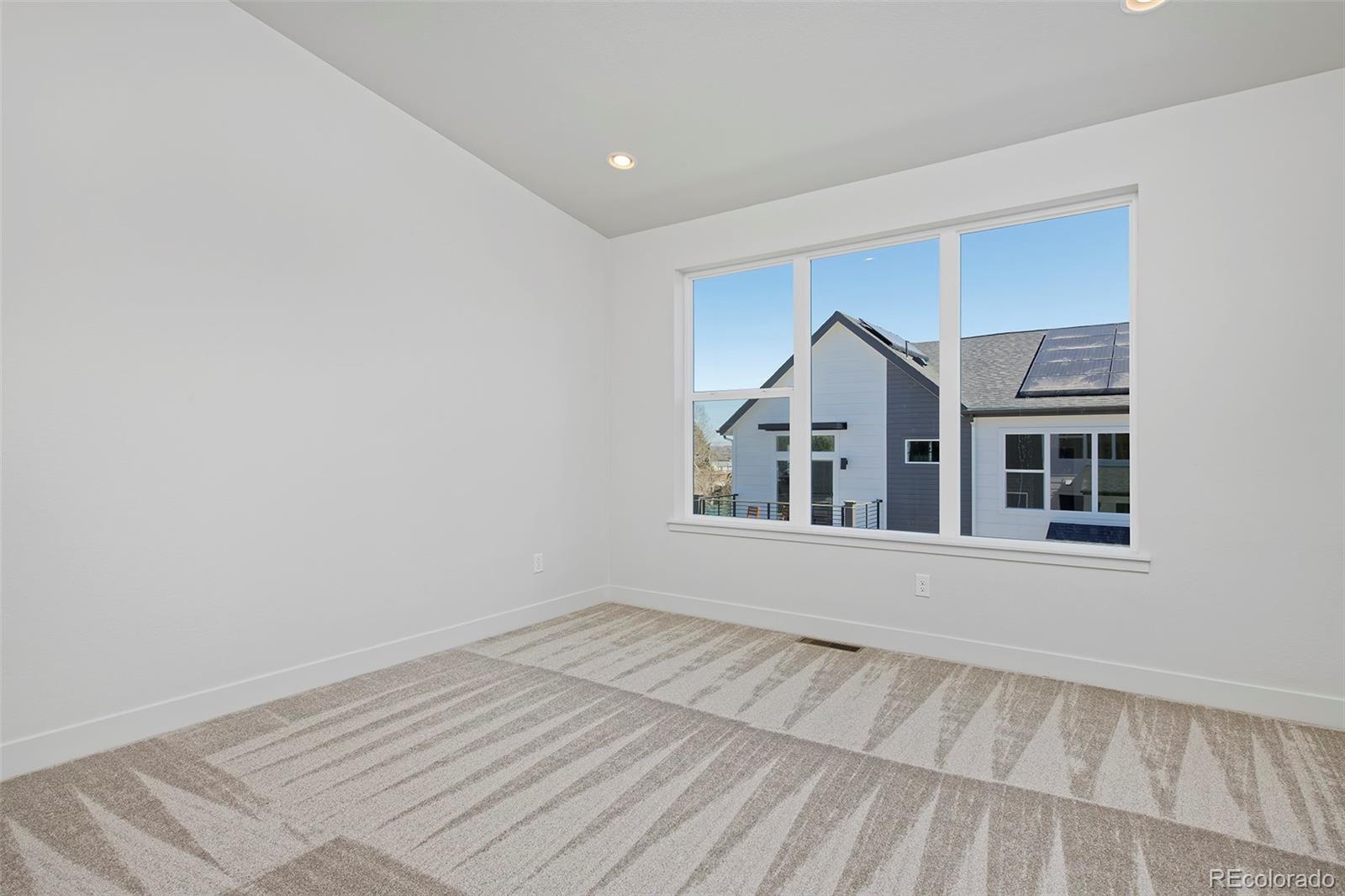 3136 West Bonfils Place Denver, CO 80236 - Photo 30 of 43 a view of an empty room with a window