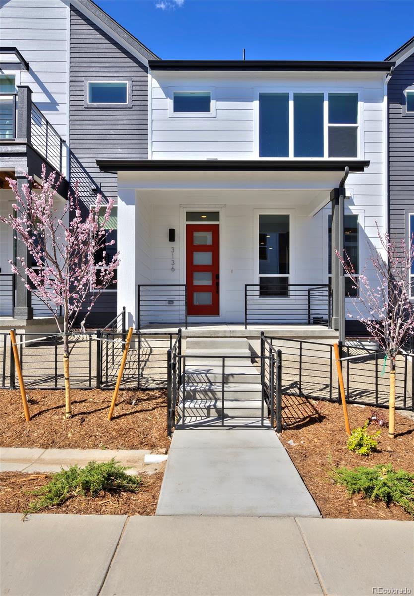 3136 West Bonfils Place Denver, CO 80236 - Photo 5 of 43 front view of a building with a street
