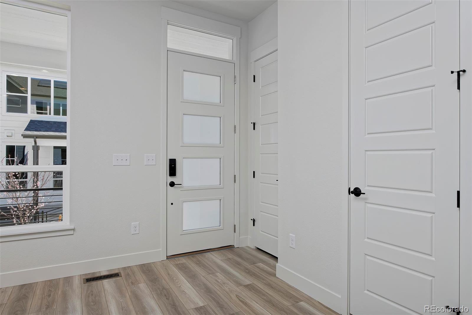 3136 West Bonfils Place Denver, CO 80236 - Photo 9 of 43 an empty room with windows