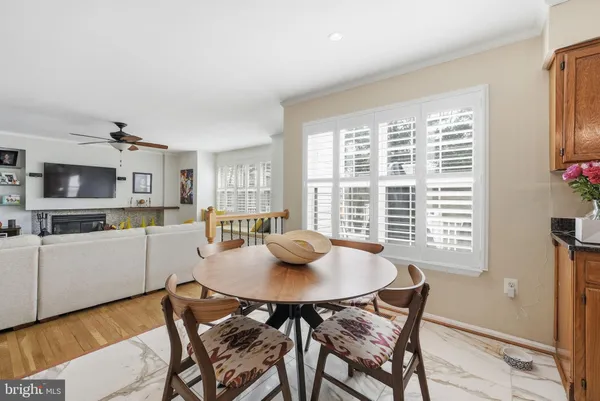 a view of a dining room with furniture and window