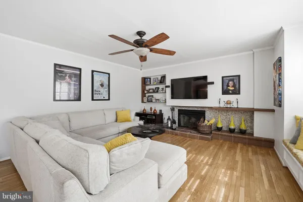a living room with fireplace furniture and a flat screen tv