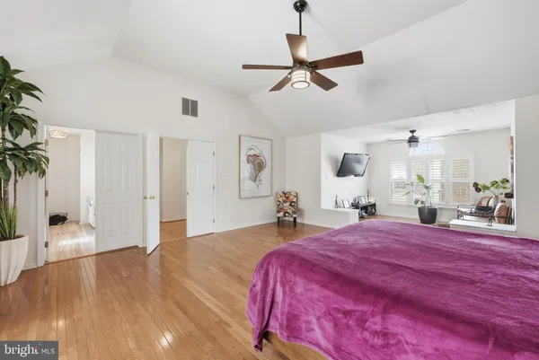 a bed room with a bed and a chandelier