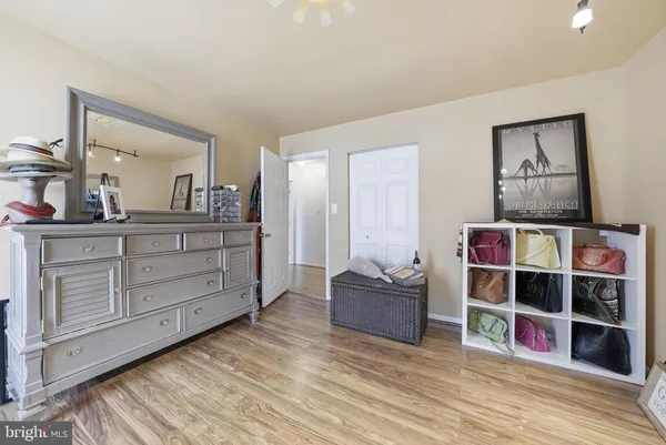 a view of bedroom with furniture and wooden floor