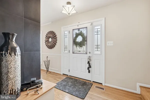 a view of an entryway with wooden floor
