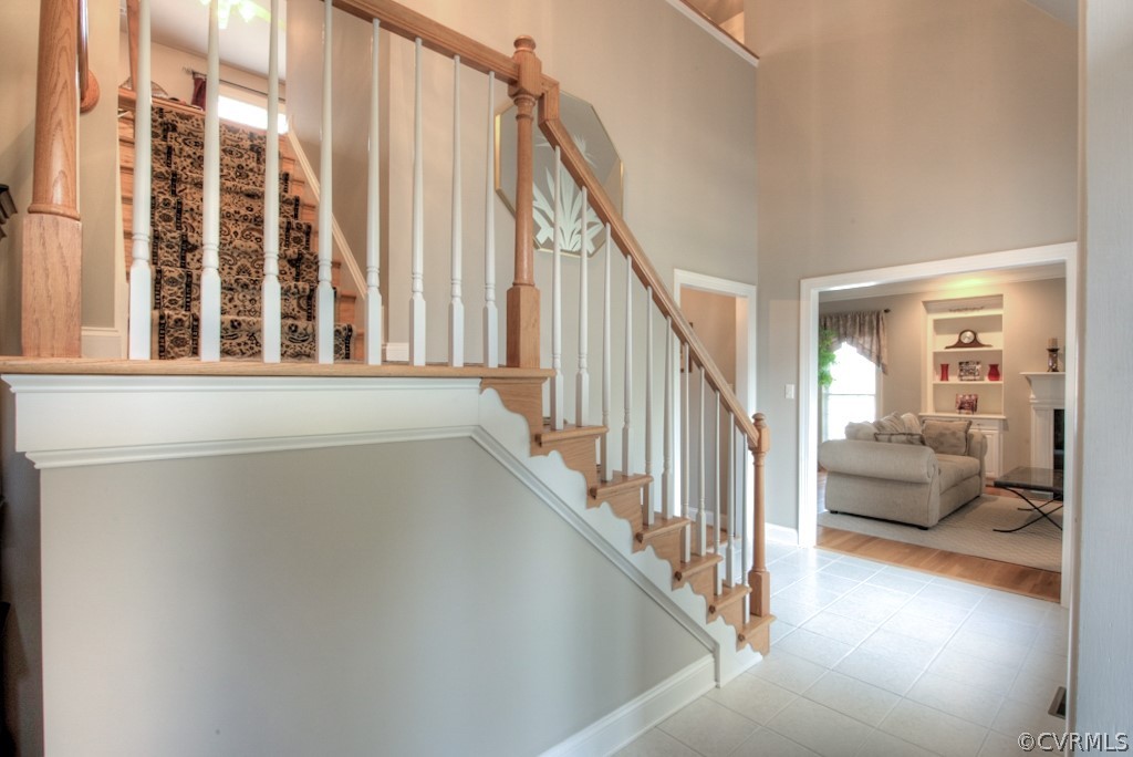 5800 Spinnaker Cove Road Midlothian, VA 23112 - Photo 12 of 50 Custom staircase with crown moulding details.