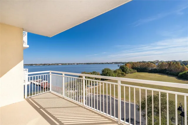 a view of a balcony with wooden floor