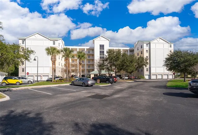a view of a street with cars on the road