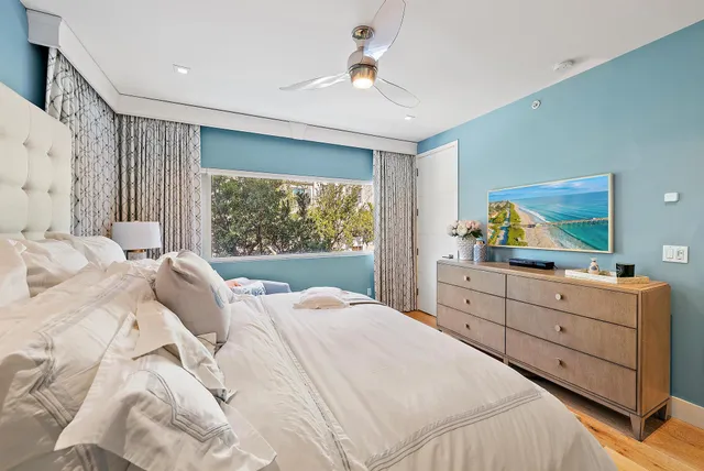 a bedroom with a bed and a dresser