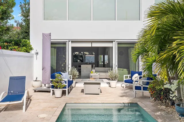 a view of house with outdoor seating