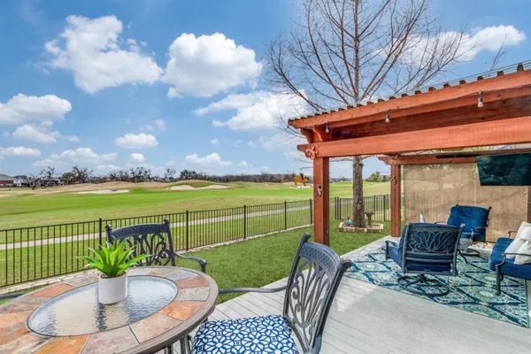a view of a patio with furniture