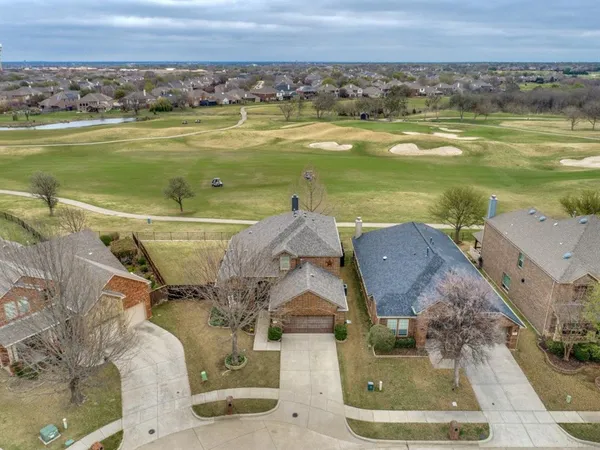 an aerial view of a house with a ocean view