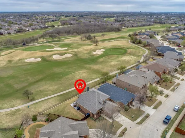 an aerial view of residential house with outdoor space