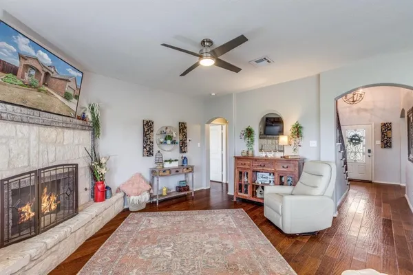 a living room with furniture and a fireplace
