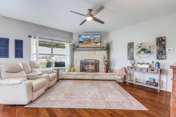 a living room with furniture and a fireplace