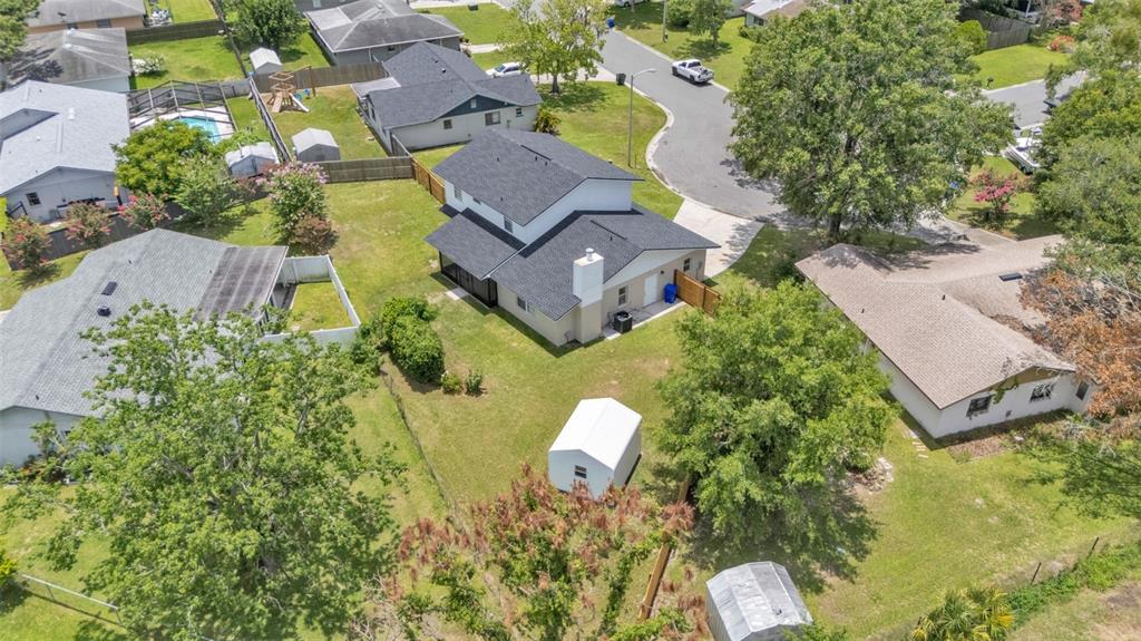 3806 Bent Tree Loop West Lakeland, FL 33813 - Photo 15 of 58 an aerial view of a house with a garden and yard