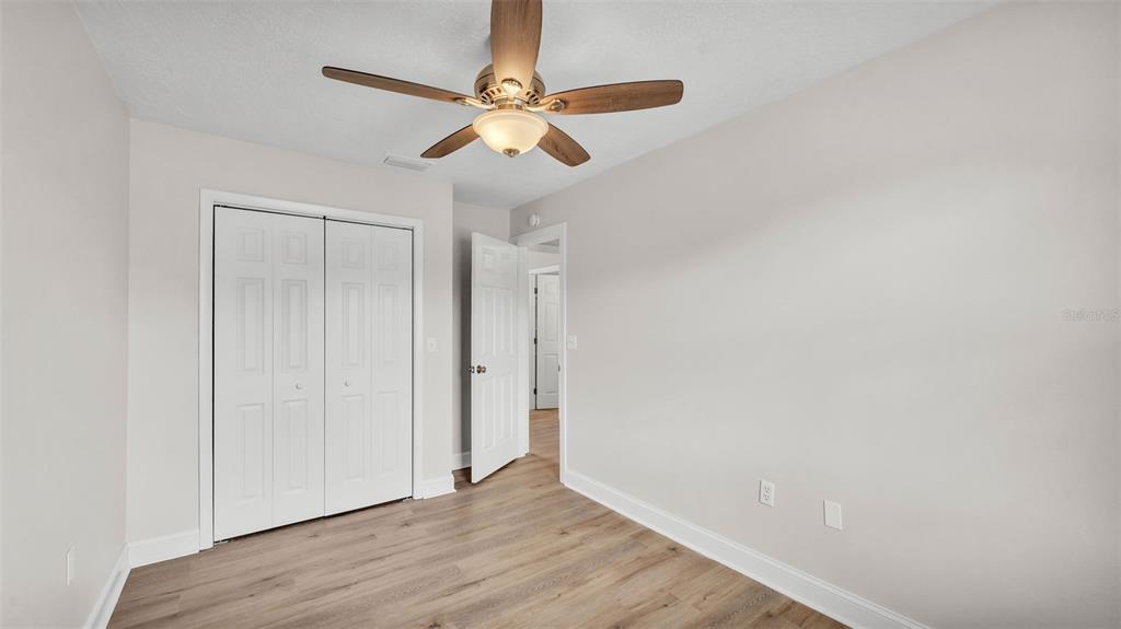3806 Bent Tree Loop West Lakeland, FL 33813 - Photo 19 of 58 a view of an empty room with wooden floor