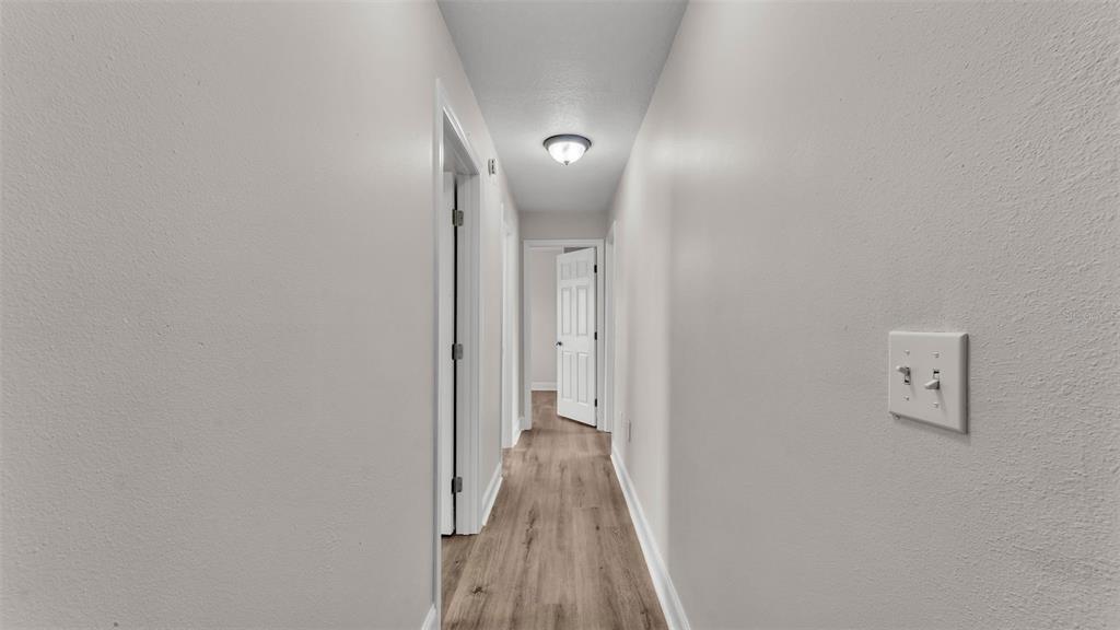 3806 Bent Tree Loop West Lakeland, FL 33813 - Photo 20 of 58 a view of a hallway with wooden floor