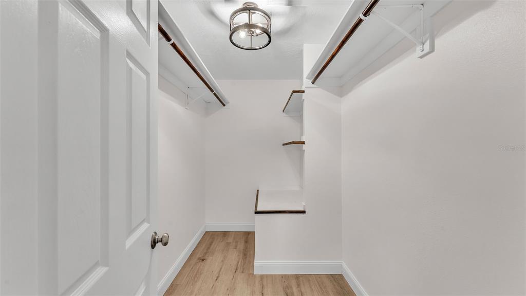3806 Bent Tree Loop West Lakeland, FL 33813 - Photo 22 of 58 a view of a hallway with wooden floor and entryway