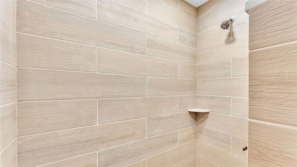 3806 Bent Tree Loop West Lakeland, FL 33813 - Photo 24 of 58 a bathroom with a shower