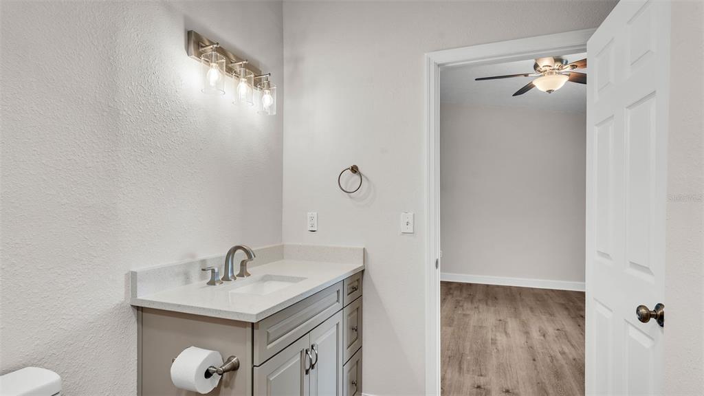 3806 Bent Tree Loop West Lakeland, FL 33813 - Photo 25 of 58 a bathroom with a sink and mirror