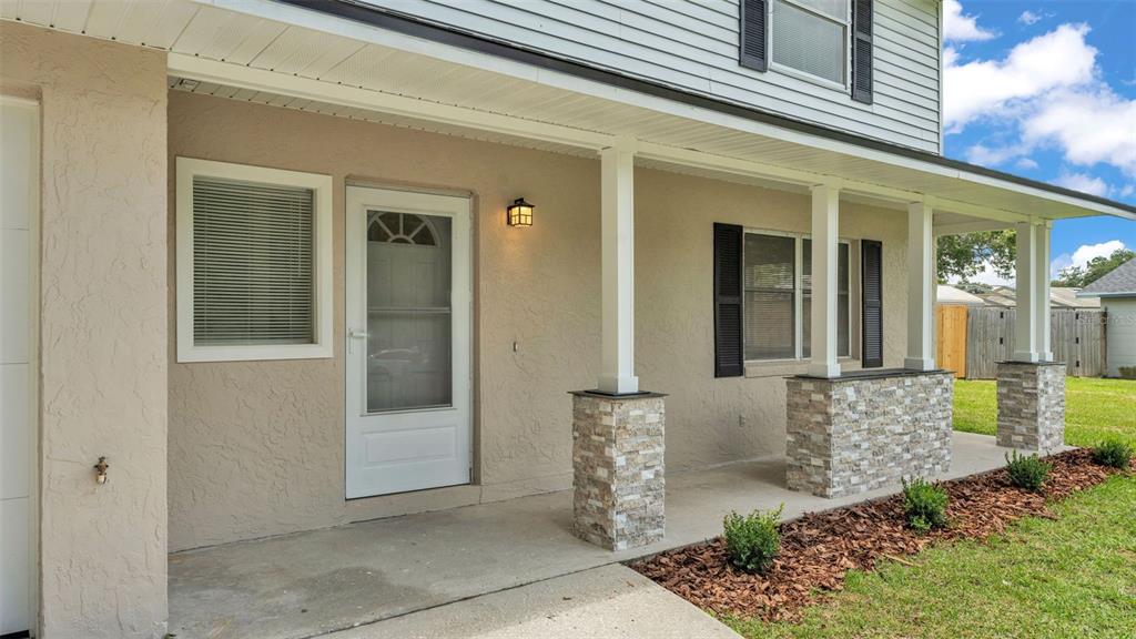 3806 Bent Tree Loop West Lakeland, FL 33813 - Photo 3 of 58 front view of a house with a glass door