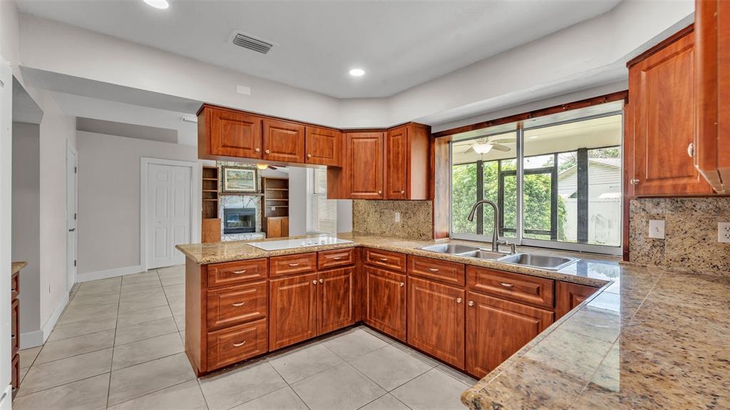 3806 Bent Tree Loop West Lakeland, FL 33813 - Photo 38 of 58 a kitchen with a sink and a window