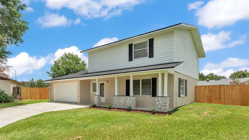 3806 Bent Tree Loop West Lakeland, FL 33813 - Photo 4 of 58 a view of a house with a yard