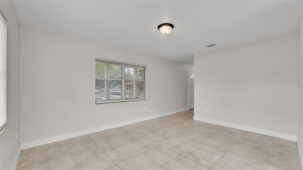 3806 Bent Tree Loop West Lakeland, FL 33813 - Photo 45 of 58 an empty room with windows
