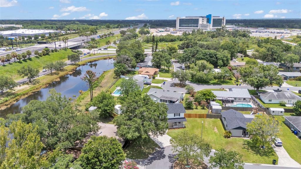 3806 Bent Tree Loop West Lakeland, FL 33813 - Photo 54 of 58 an aerial view of residential houses with outdoor space and lake view
