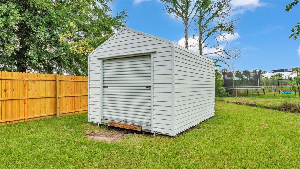 3806 Bent Tree Loop West Lakeland, FL 33813 - Photo 55 of 58 a view of a backyard with a garden