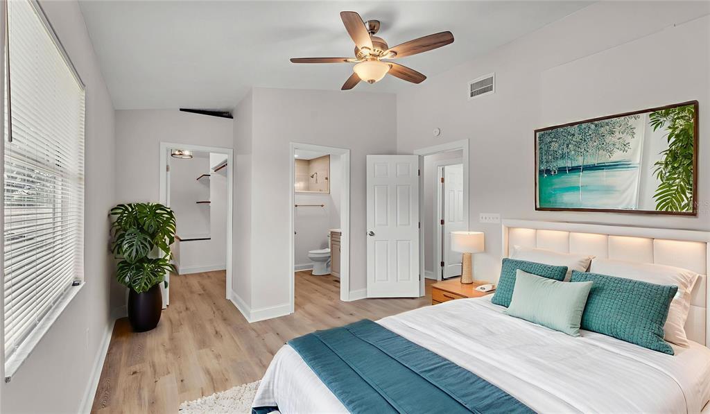 3806 Bent Tree Loop West Lakeland, FL 33813 - Photo 57 of 58 a bedroom with a bed and a large window