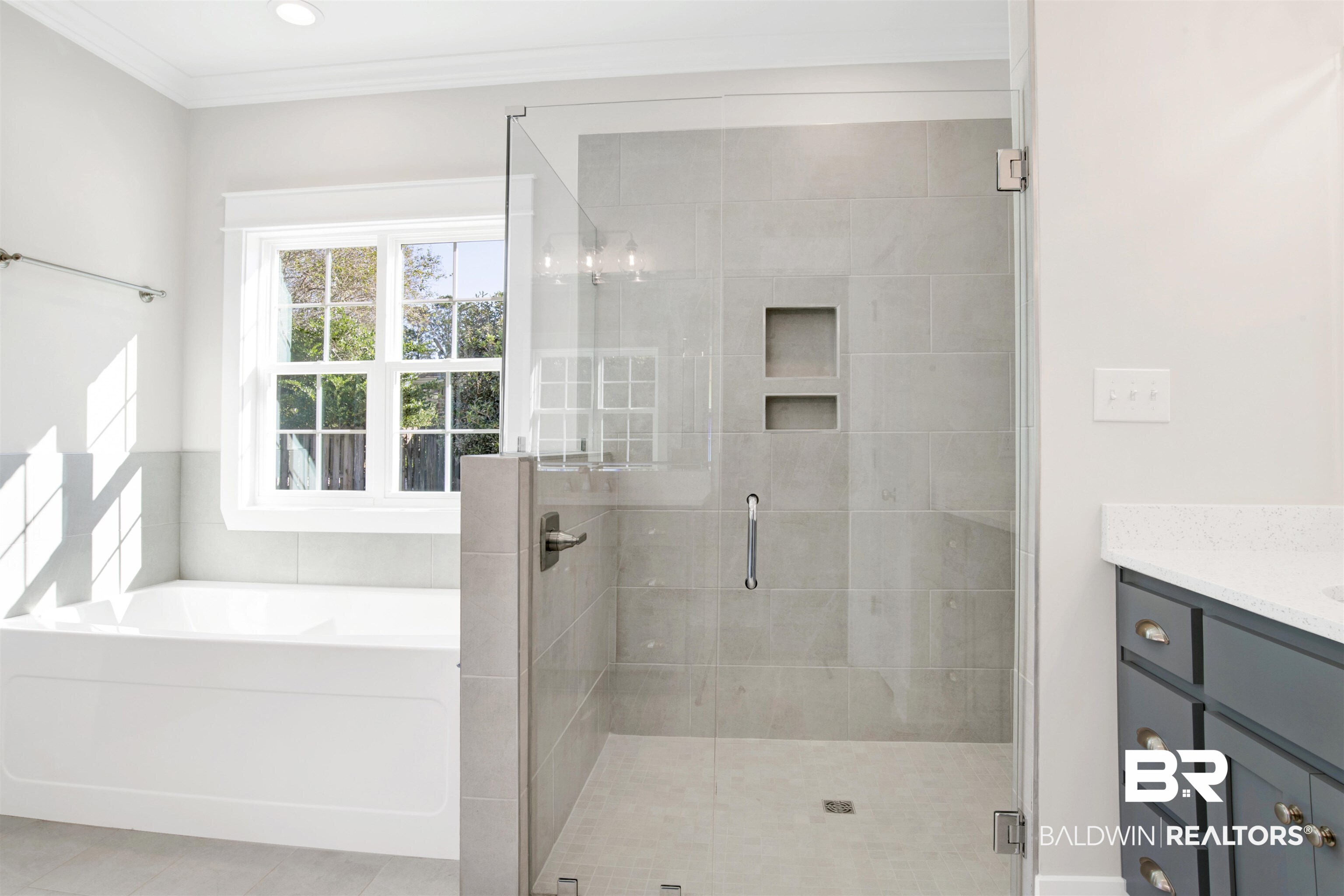 9687 Widgeon Court Daphne, AL 36526 - Photo 21 of 40 Bathroom featuring tile patterned flooring, vanity, ornamental molding, and plus walk in shower